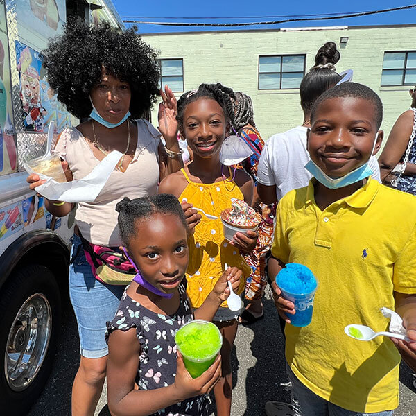 students outside enjoying treats