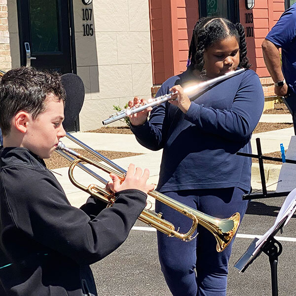 students playing flute and trumpet